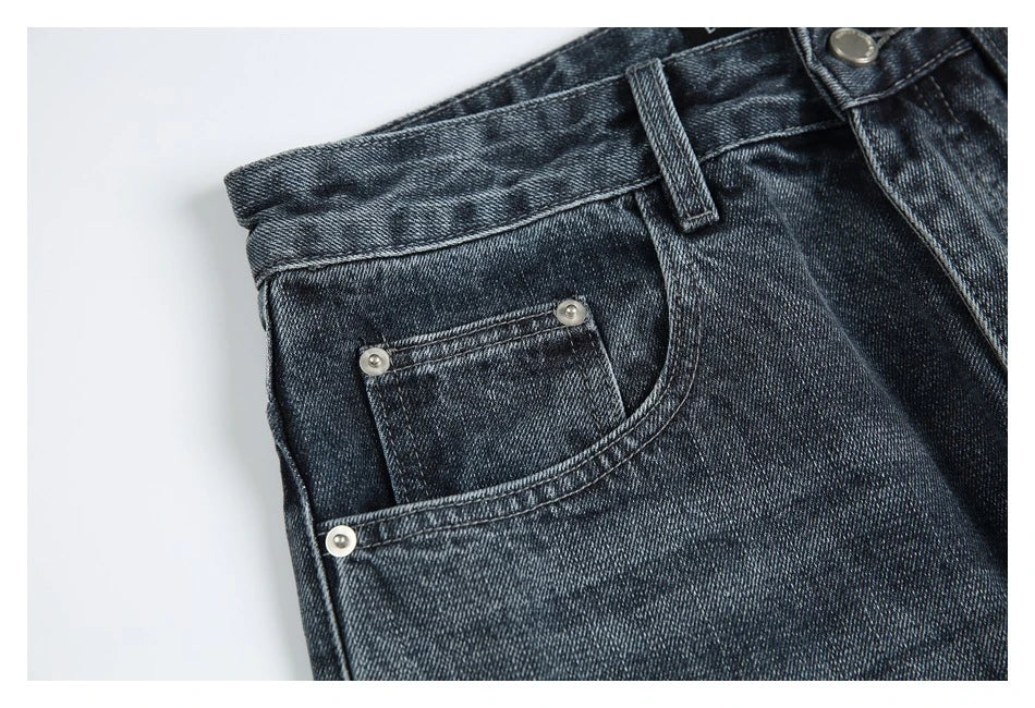 A pair of stylish retro-inspired Japanese jeans in black and grey, featuring a mid-rise waist and straight leg silhouette for a flattering, comfortable fit.
