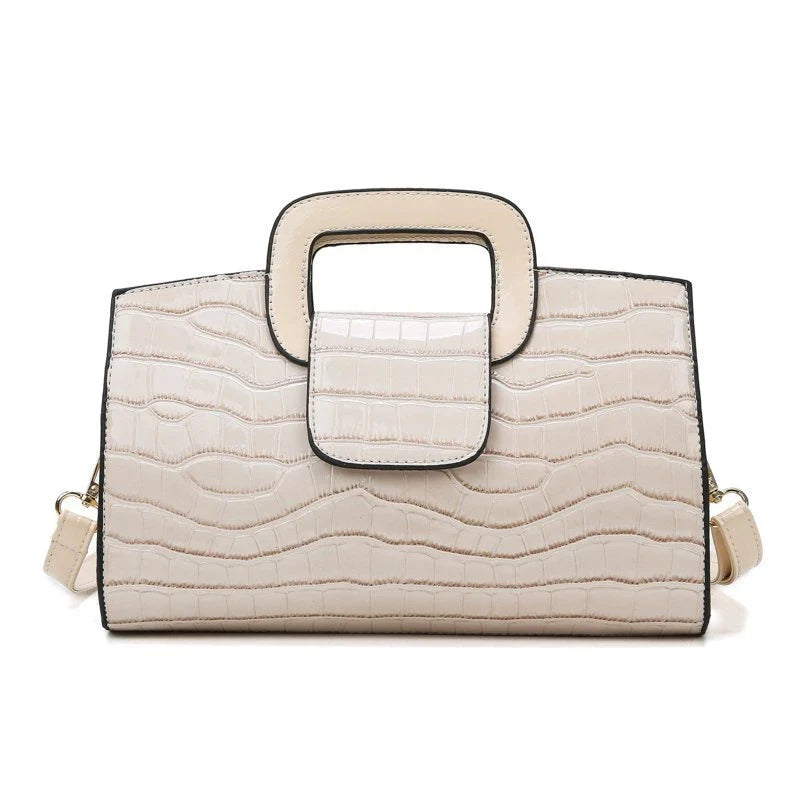 A stylish and versatile retro-patterned handbag with a sturdy canvas construction and organised interior, perfect for everyday use in the UK.