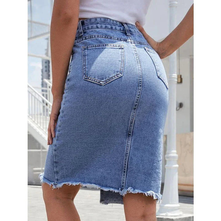 High-waist denim midi skirt with split hem and zipper closure, made from a comfortable cotton-polyester blend for a flattering, structured fit.