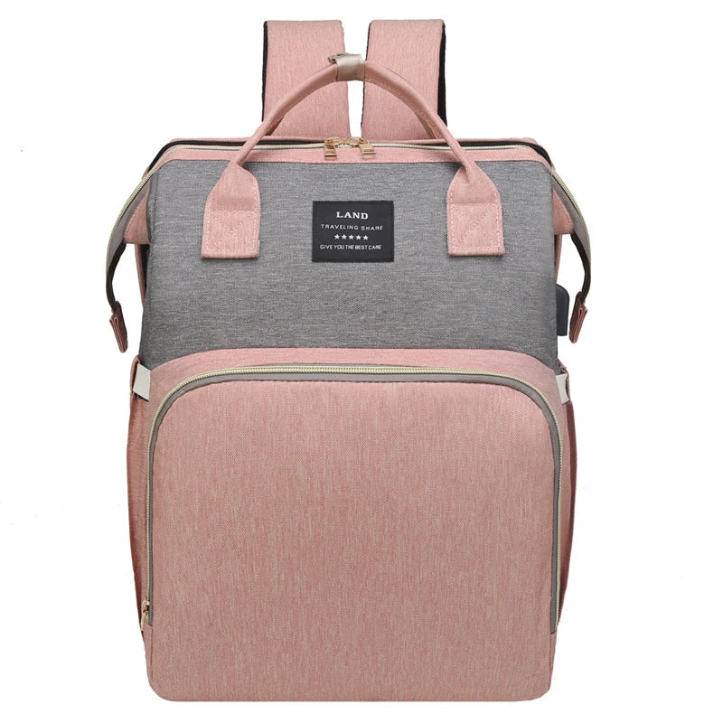 Multifunctional maternity diaper backpack with removable mosquito net, foldable crib, and water-resistant design for convenient family travel