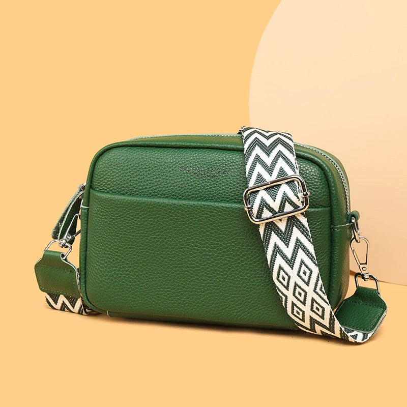 Stylish leather crossbody bag with embroidered strap in various colours