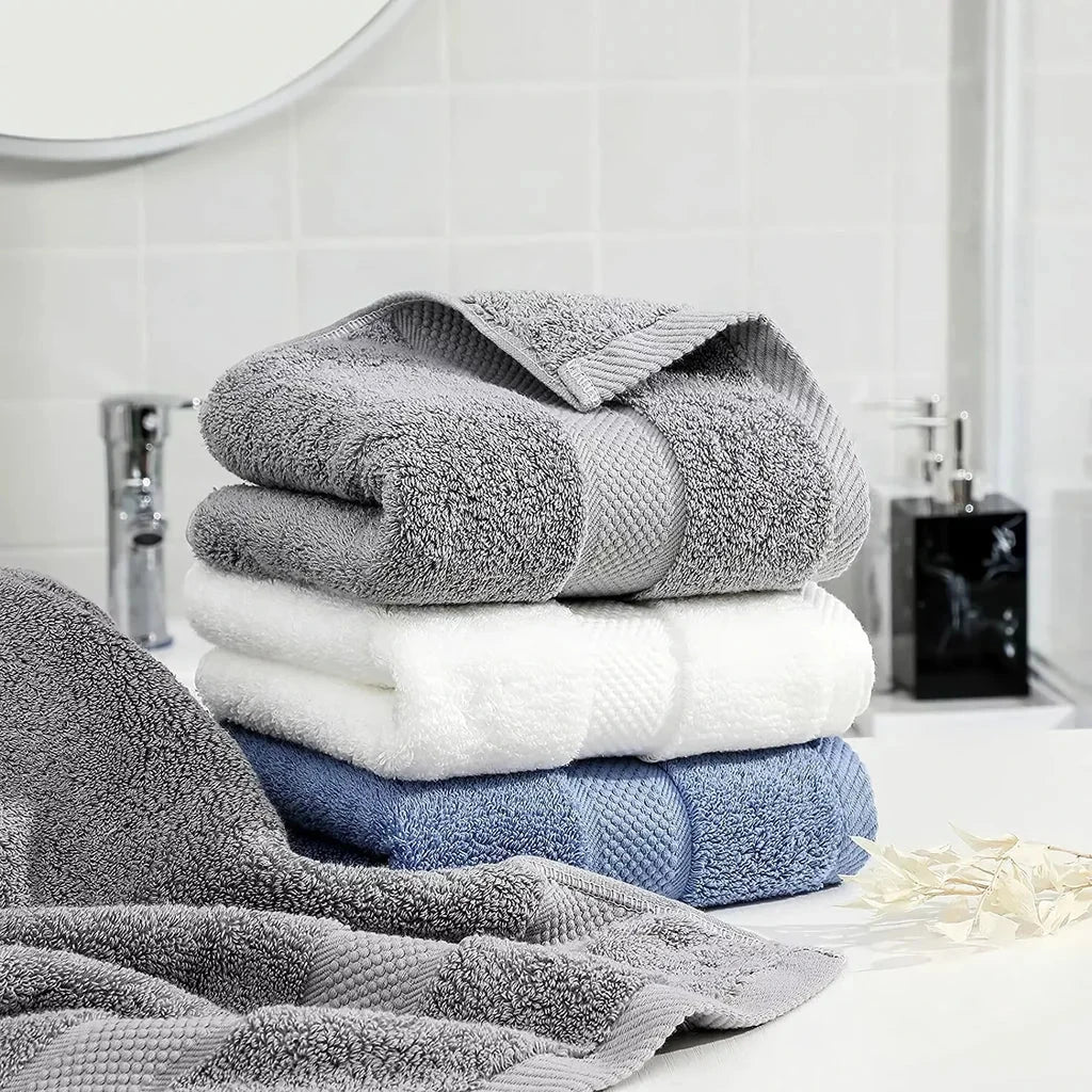 Premium 100% cotton face towel in blue, featuring a soft and absorbent design for daily facial cleansing and bathing