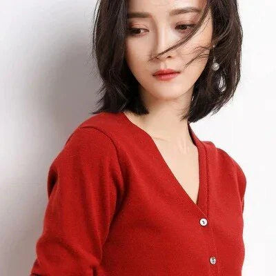 Chic v-neck single breasted cardigan in blue, green, and pink colours with a sophisticated and timeless design