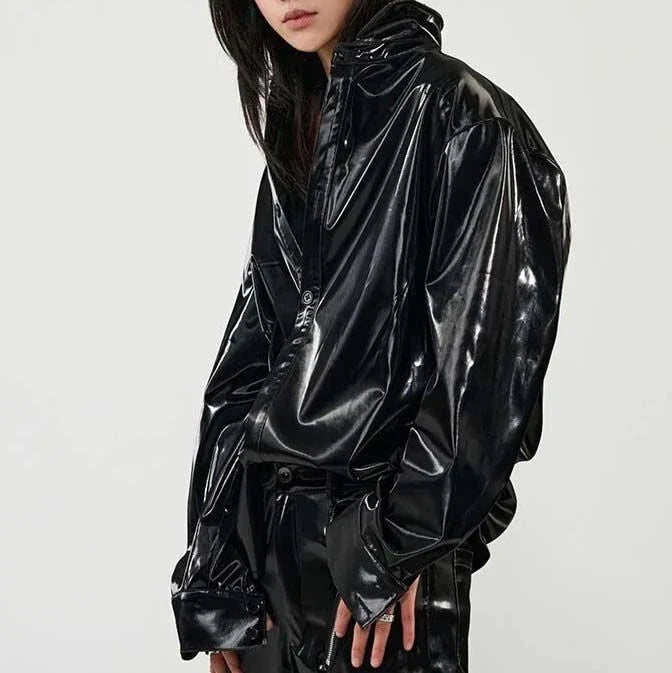 Elegant, fleece-lined PU leather jacket in a sleek, glossy black finish for timeless style and comfort