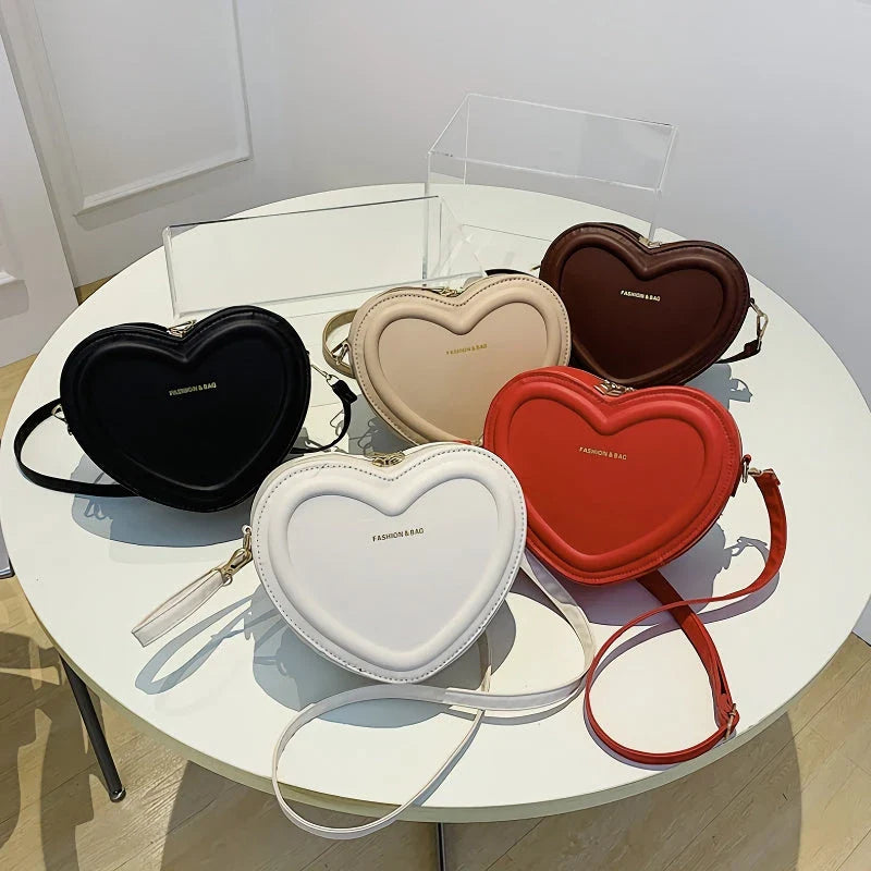 Chic heart-shaped crossbody bag made from premium PU leather, available in multiple stylish colours