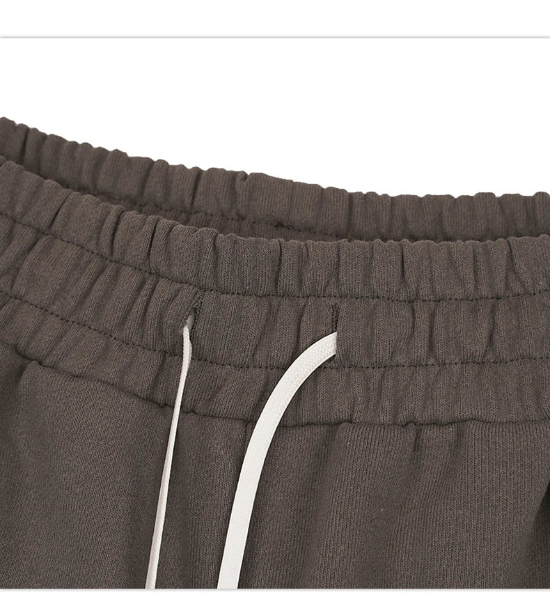 Premium loose-fit sports shorts with eye-catching printed patterns in black, khaki, and dark grey colours