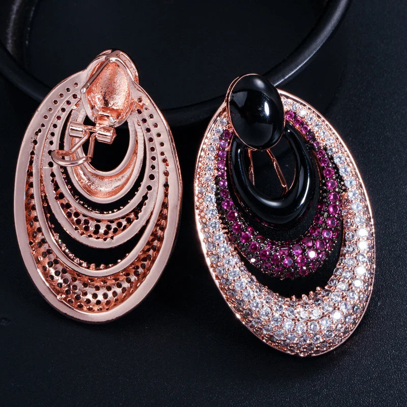 Elegant water drop-shaped ear studs in a vibrant red hue, adorned with a micro-inlaid zircon gemstone for a dazzling, sophisticated look.