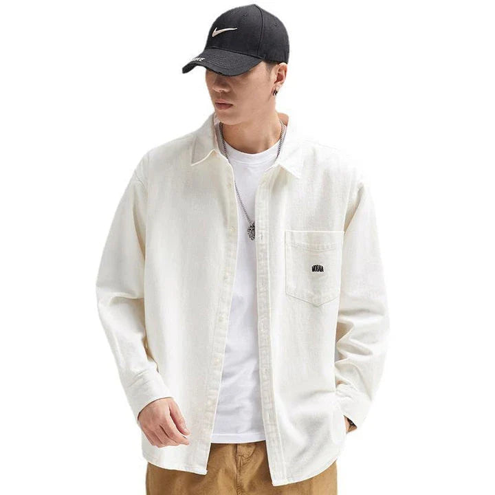 A relaxed, loose-fitting men's shirt in a retro-inspired design, crafted from premium cotton for exceptional comfort and style.
