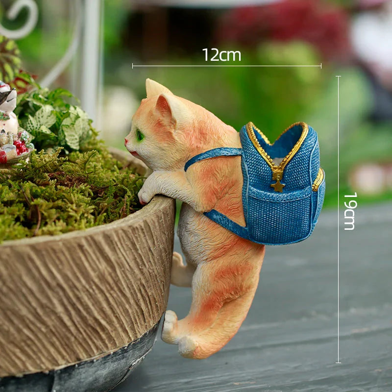 A charming resin cat figurine wearing a stylish backpack, serving as a unique garden decoration and practical storage solution.