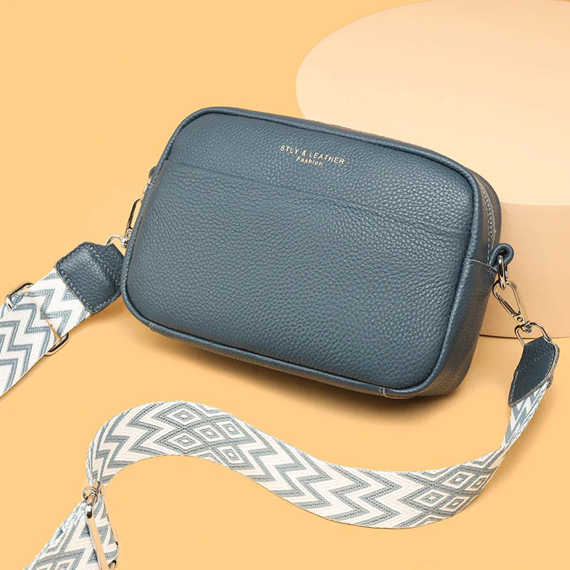 Stylish leather crossbody bag with embroidered strap in various colours