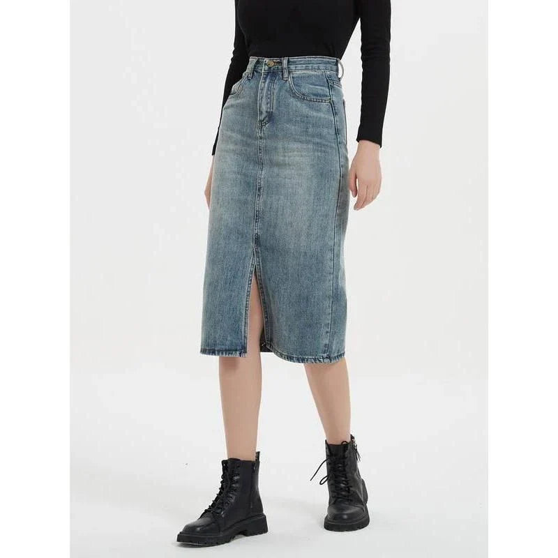 A high-waist denim pencil skirt with a classic A-line silhouette, perfect for the modern British woman.