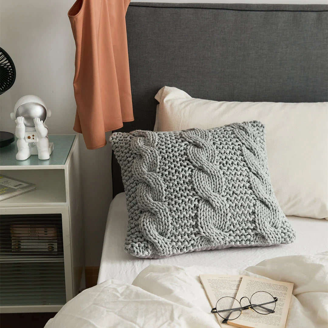Luxurious hand-crocheted chunky knit throw pillow in a range of vibrant colours, providing cosy comfort and sophisticated style.