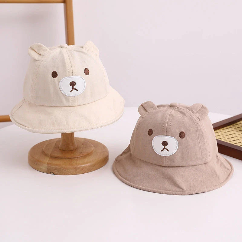 Adorable kids' bear-themed panama bucket hat with soft, breathable fabric and adjustable fit for sun protection and style