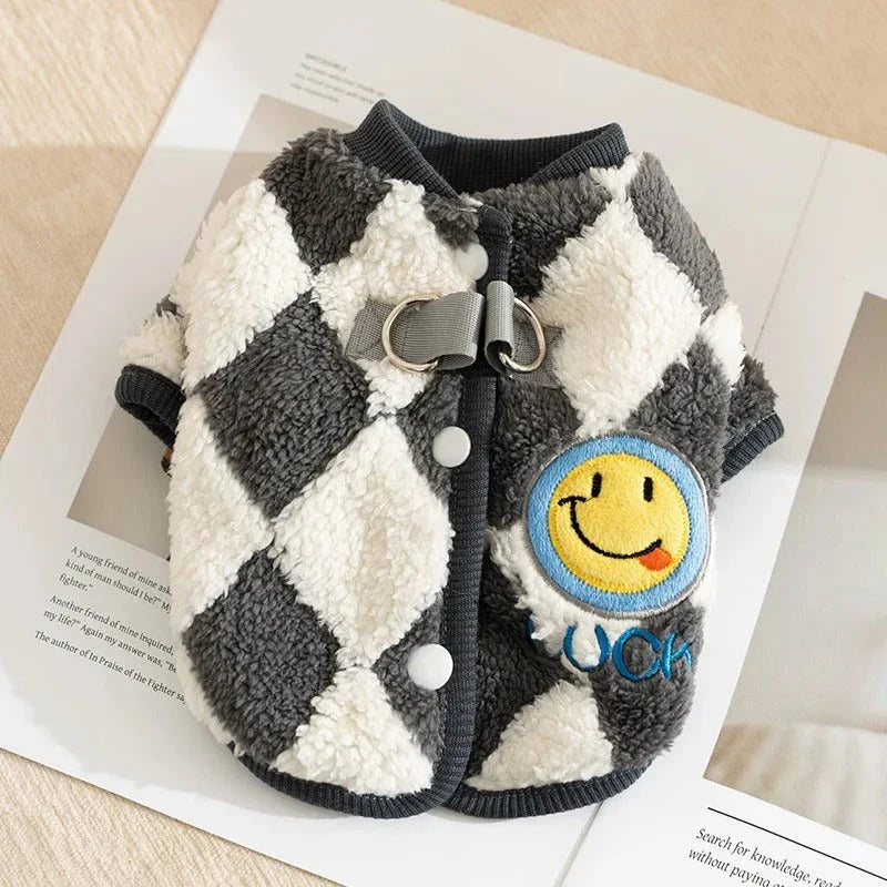 A stylish checkered fleece coat for small and medium-sized dogs, providing warmth and comfort during the chilly British autumn and winter seasons.