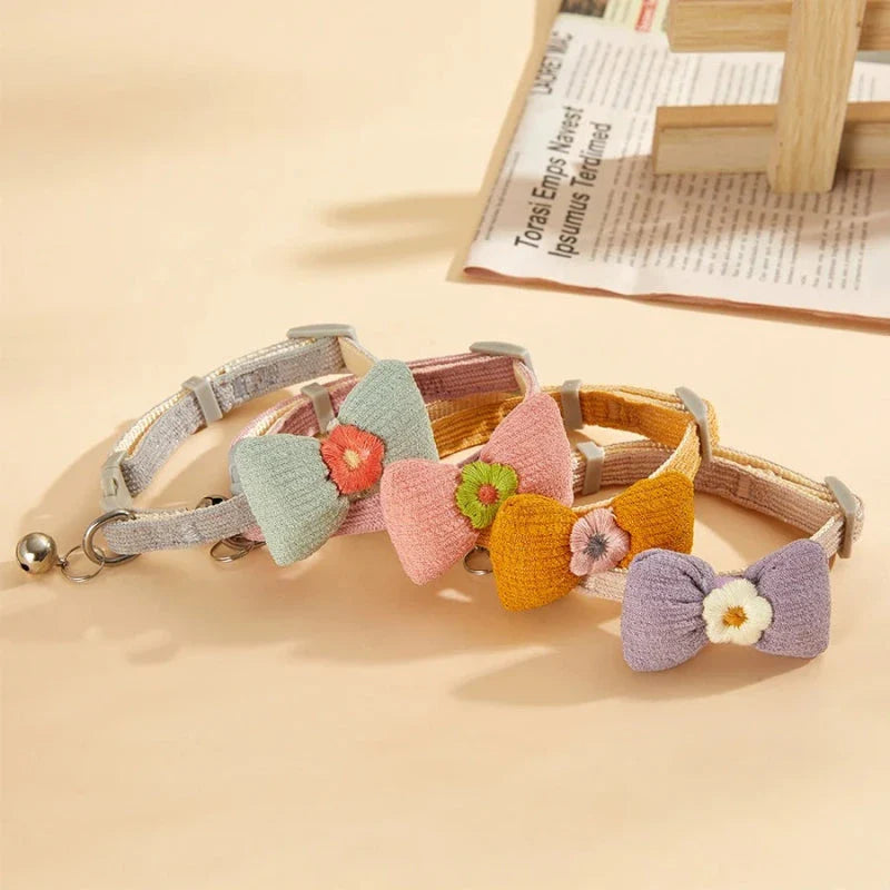 Stylish checkered pet collar with elegant butterfly knot decoration, perfect for dressing up cats and dogs
