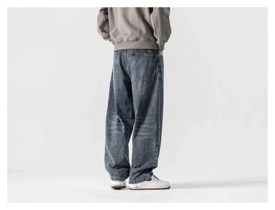 A pair of stylish retro-inspired Japanese jeans in black and grey, featuring a mid-rise waist and straight leg silhouette for a flattering, comfortable fit.