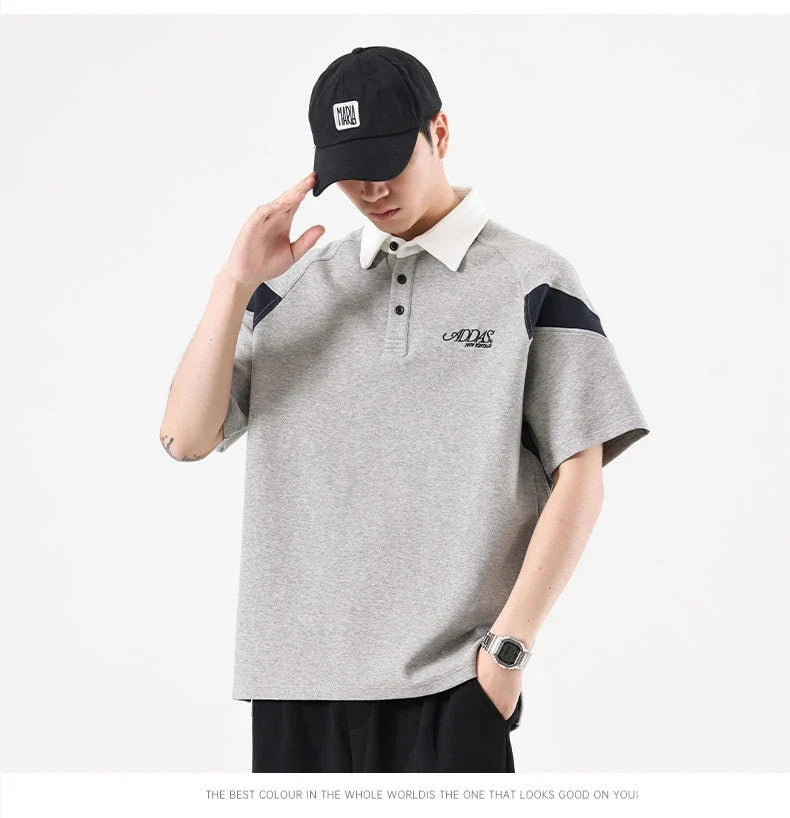 Melange grey polo shirt with contrast stitching, designed and made in Britain for comfortable summer wear