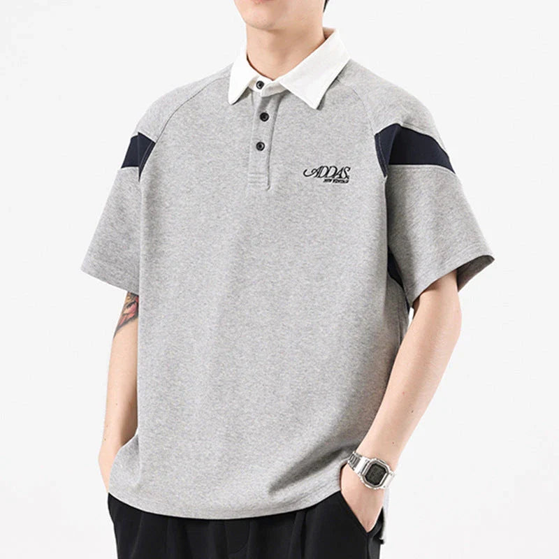 Melange grey polo shirt with contrast stitching, designed and made in Britain for comfortable summer wear