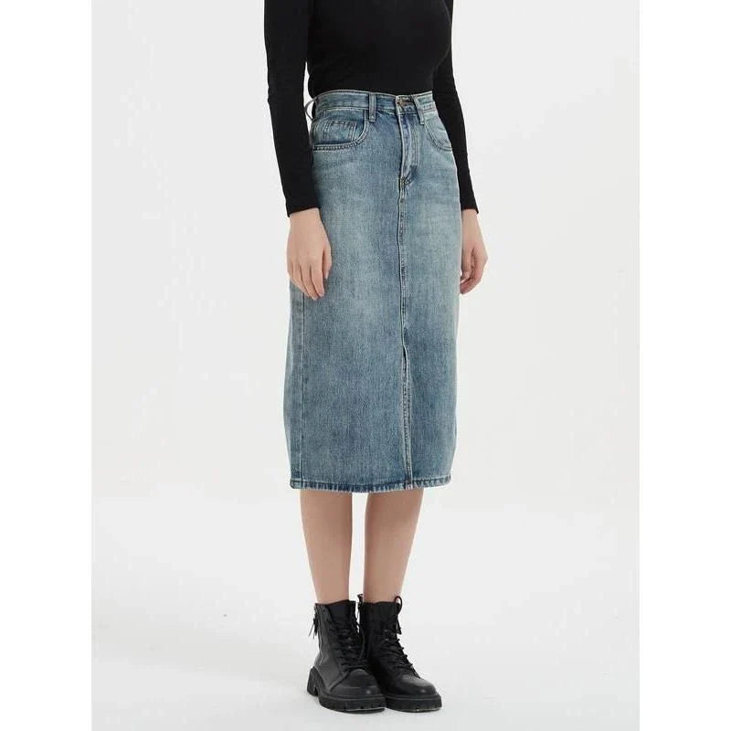 A high-waist denim pencil skirt with a classic A-line silhouette, perfect for the modern British woman.