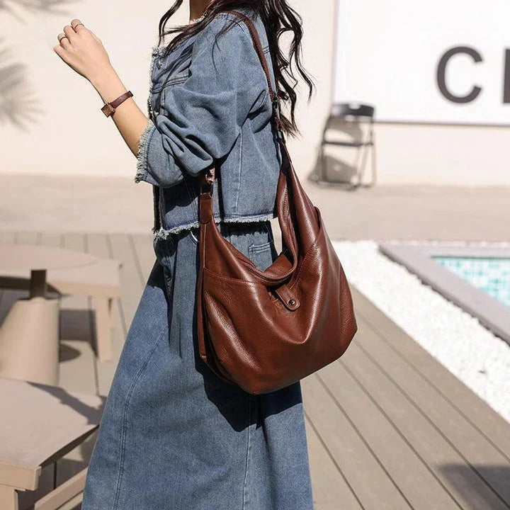 High-quality genuine leather crossbody hobo bag for women with a unique stone pattern and ample interior storage