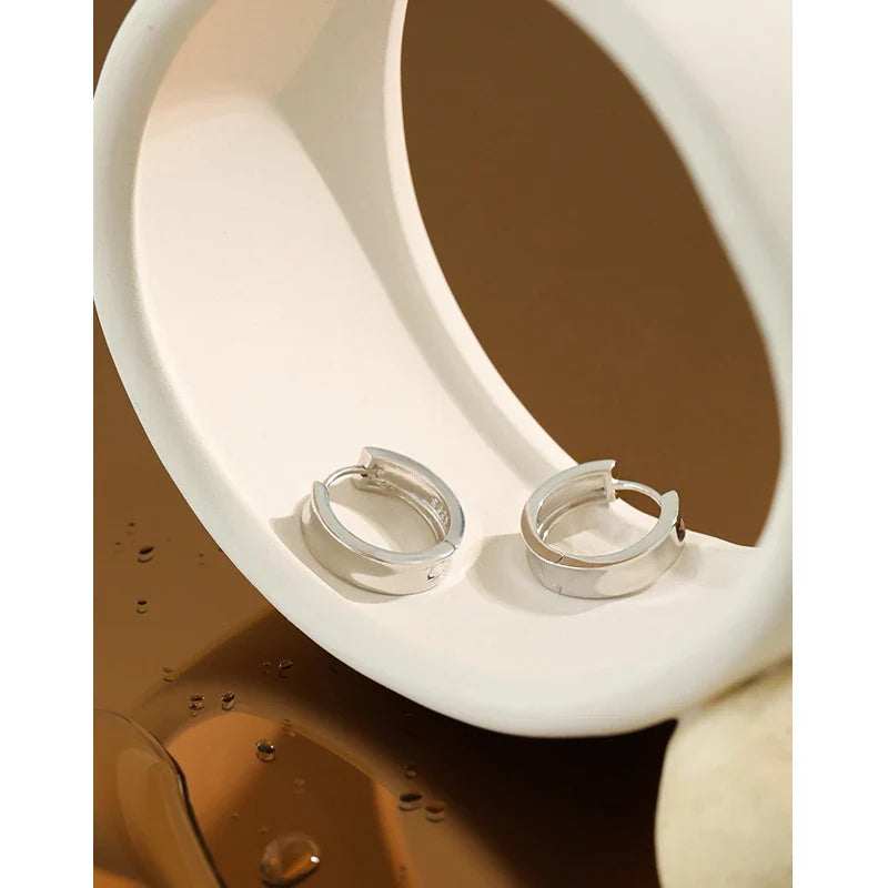 Pair of elegant 925 sterling silver geometric circle earrings in a trendy Korean style