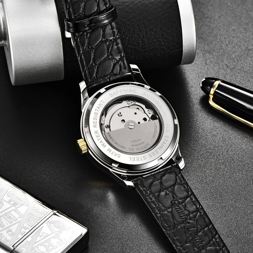 A sophisticated automatic mechanical watch with a gold/white or gold/black face, stainless steel case, and genuine leather strap