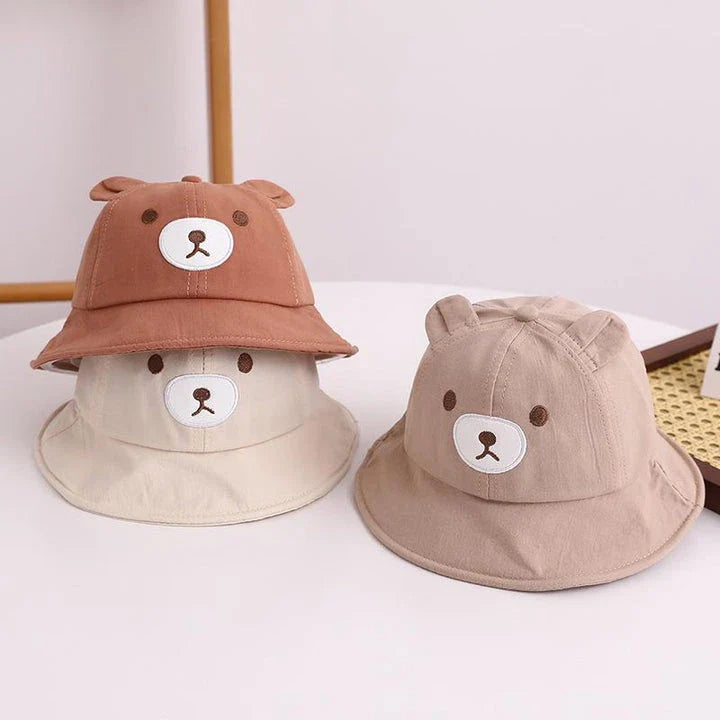 Adorable kids' bear-themed panama bucket hat with soft, breathable fabric and adjustable fit for sun protection and style