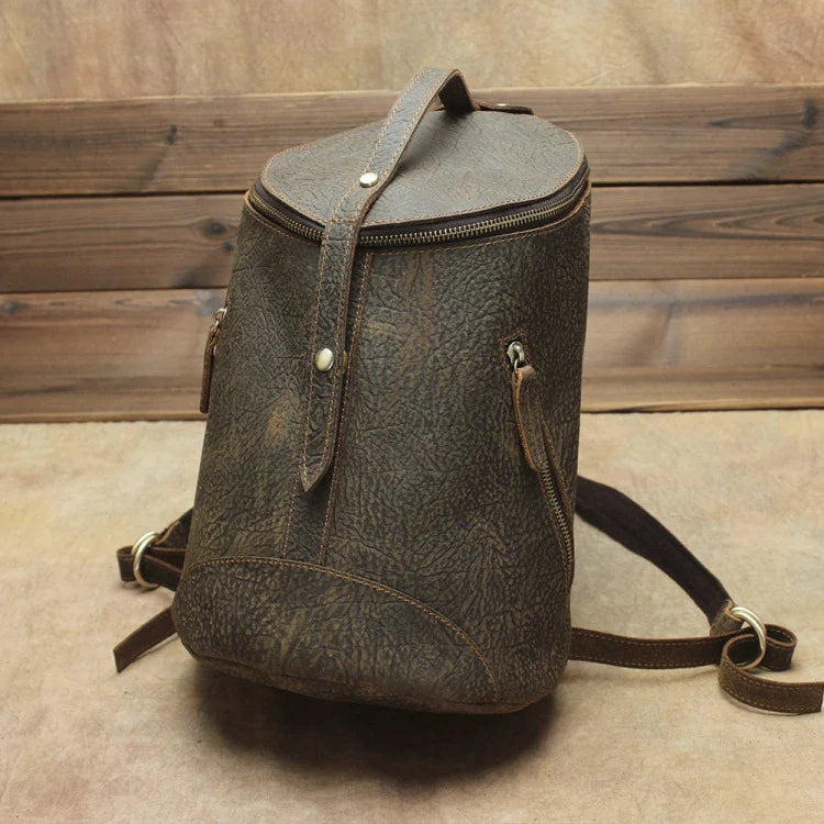 A premium Crazy Horse leather backpack with a classic bucket-style design and retro-inspired flair, perfect for the discerning urban adventurer.