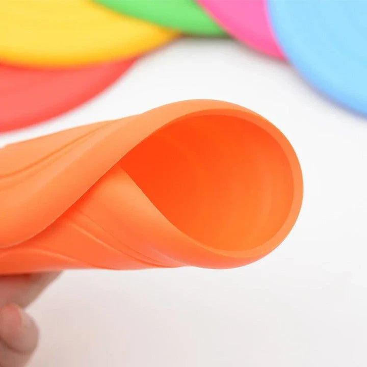 Colourful silicone frisbee dog toy with flexible, durable construction for energetic playtime