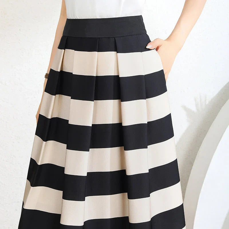 Elegant striped midi skirt with pleated design, made from premium polyester for a sophisticated and comfortable look.