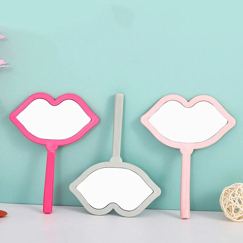 Lip-shaped handheld makeup mirror with a comfortable ergonomic handle for precise on-the-go touch-ups