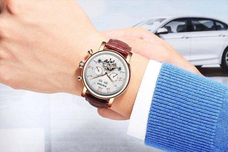 Automatic mechanical watch with genuine leather strap, featuring a stylish hollow-out dial design