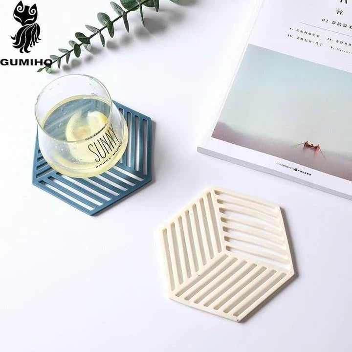 Geometric pattern cup coasters in a minimalist British design, made from durable rubber to protect surfaces