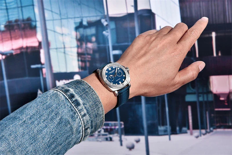 Sophisticated waterproof automatic mechanical watch with stainless steel case and textile strap, available in black, grey, green, and blue colour options