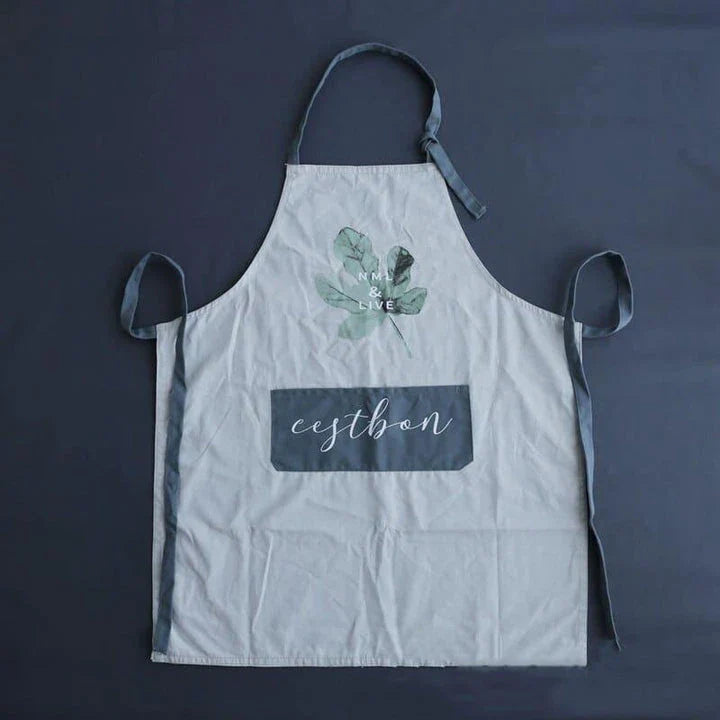 Premium cotton barista apron with a beautiful coconut leaf print design, perfect for coffee shop staff