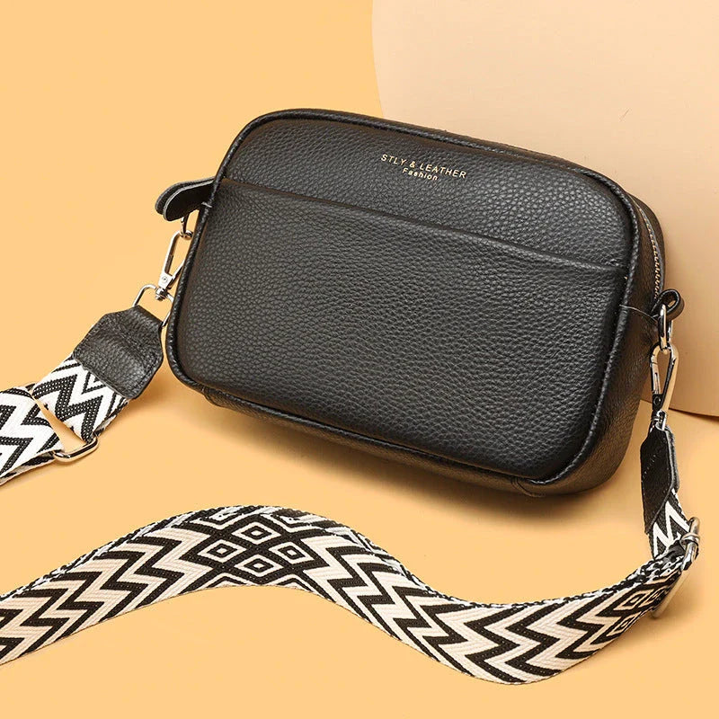 Stylish leather crossbody bag with embroidered strap in various colours