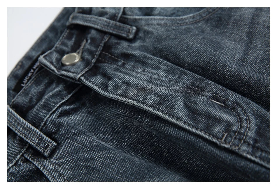 A pair of stylish retro-inspired Japanese jeans in black and grey, featuring a mid-rise waist and straight leg silhouette for a flattering, comfortable fit.