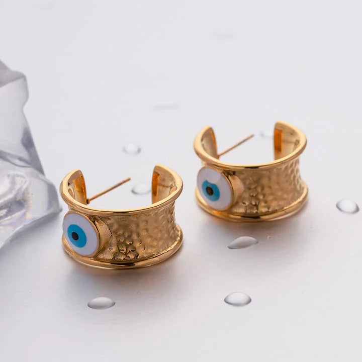 Luxury 18K gold-plated earrings with a unique Devil's Eye design and hammer grain texture in stainless steel
