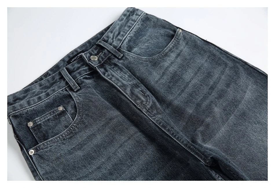 A pair of stylish retro-inspired Japanese jeans in black and grey, featuring a mid-rise waist and straight leg silhouette for a flattering, comfortable fit.