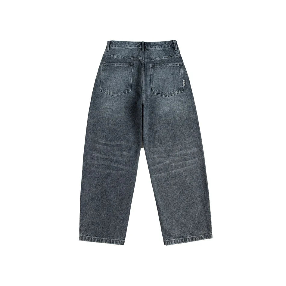 A pair of stylish retro-inspired Japanese jeans in black and grey, featuring a mid-rise waist and straight leg silhouette for a flattering, comfortable fit.