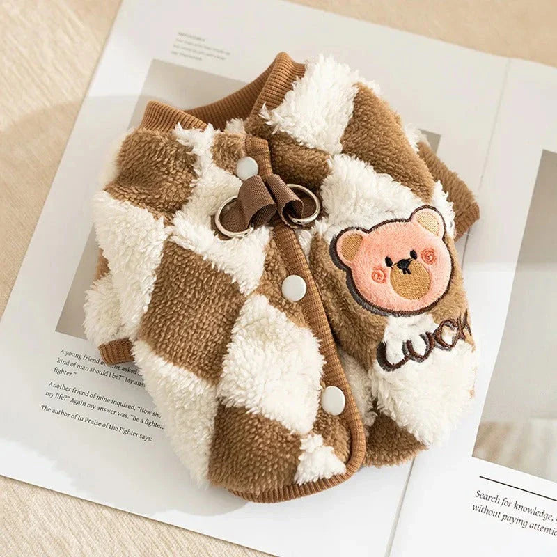 A stylish checkered fleece coat for small and medium-sized dogs, providing warmth and comfort during the chilly British autumn and winter seasons.