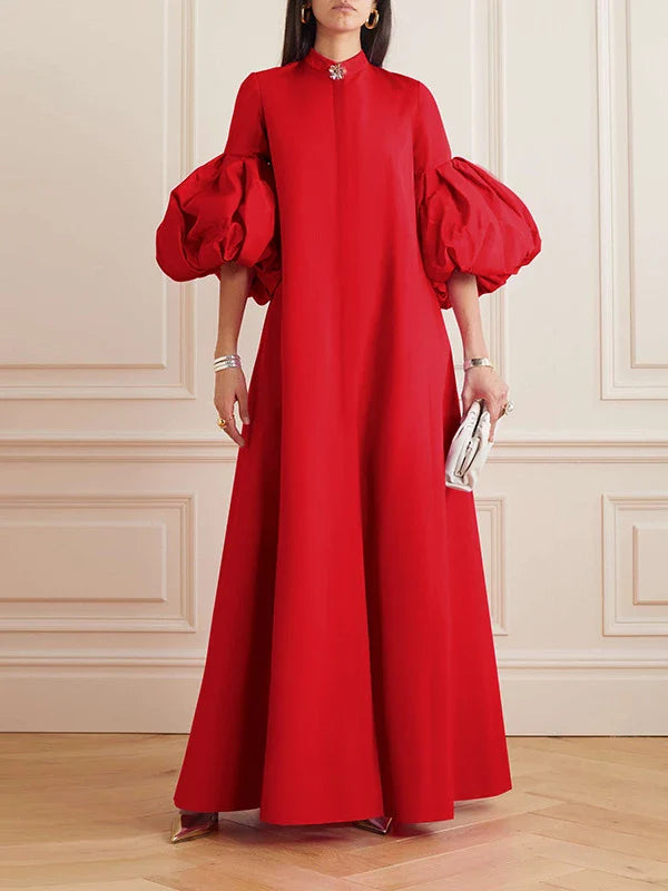 Elegant floral evening gown in a range of vibrant colours, featuring a loose, flattering fit and chic lapel design