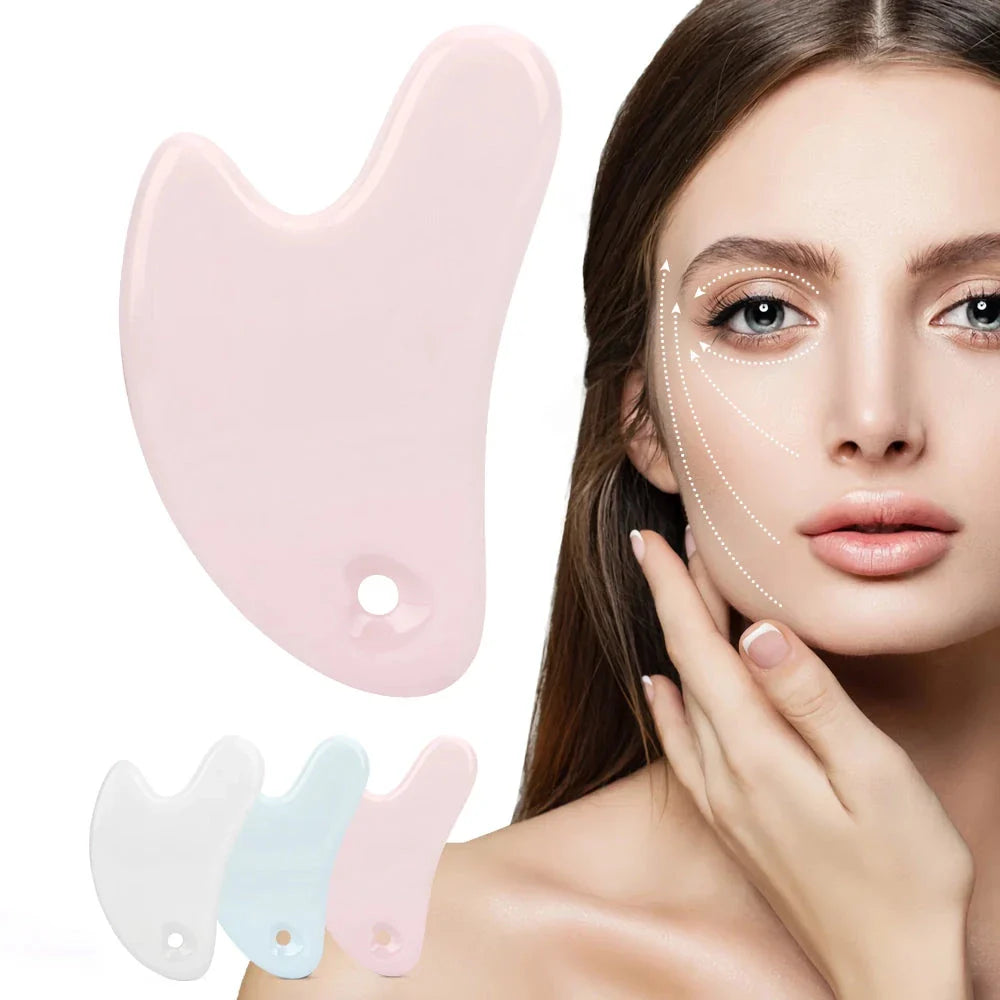 Ceramic Gua Sha facial massager in blue, pink, and white colours, designed to improve circulation and promote lymphatic drainage for radiant, youthful skin.