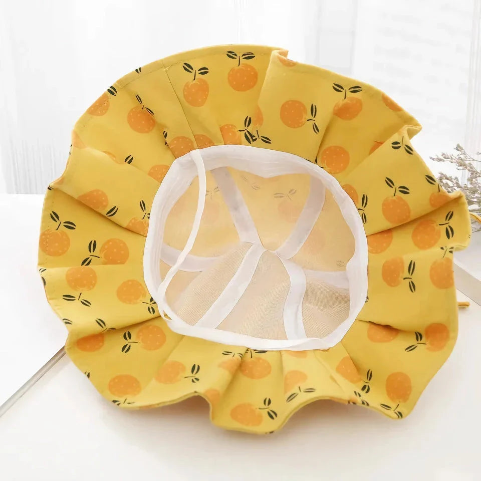 Adjustable white cotton sun protection bucket hat with cartoon pattern for children
