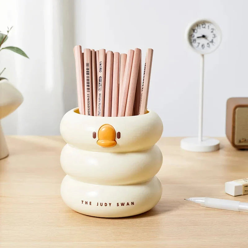 Stylish cartoon desk organiser with spacious circular design and cute cartoon motif for storing pens, pencils, and other desk essentials