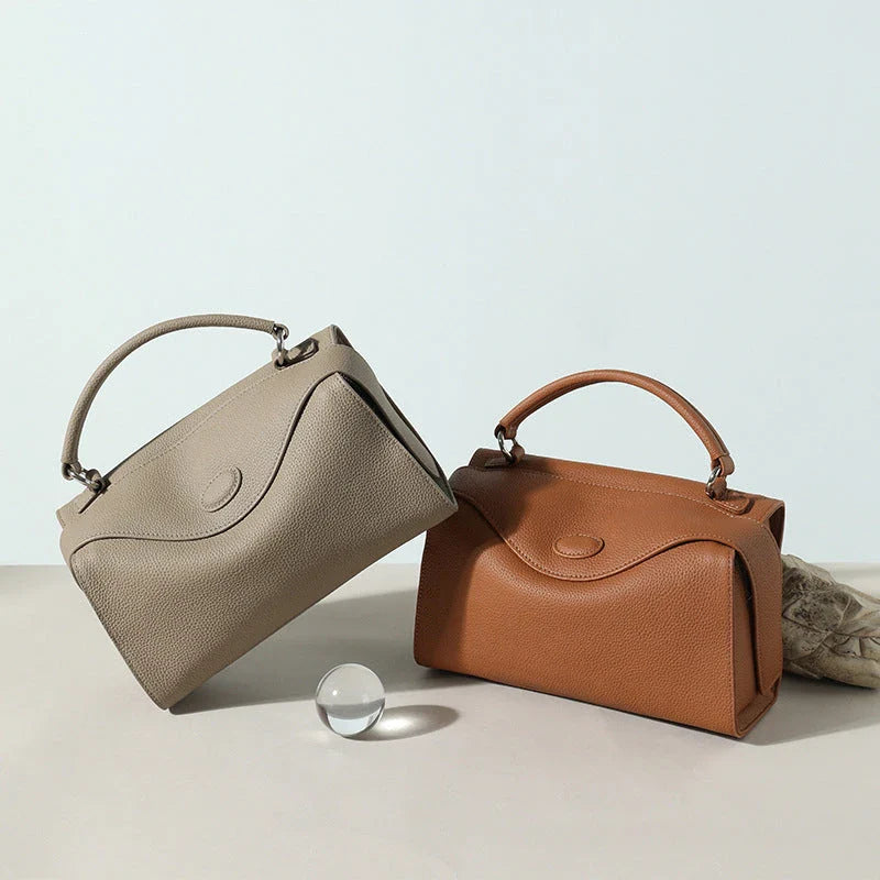 Premium British cowhide leather shoulder bag with multiple interior pockets and adjustable strap for versatile wear