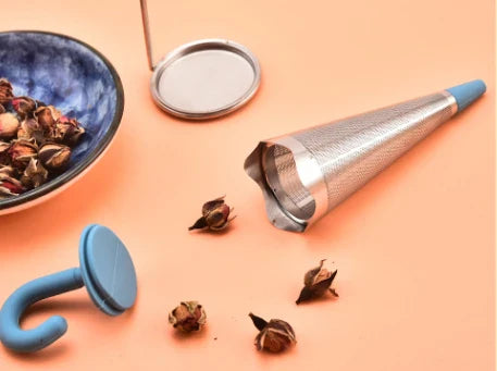 Silicone and stainless steel tea strainer with an umbrella-inspired design, available in various colours