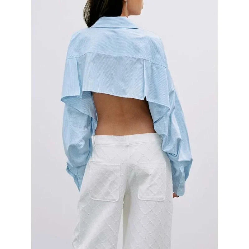 A stylish patchwork blouse with functional pockets, perfect for casual and semi-formal occasions during the autumn and winter seasons.