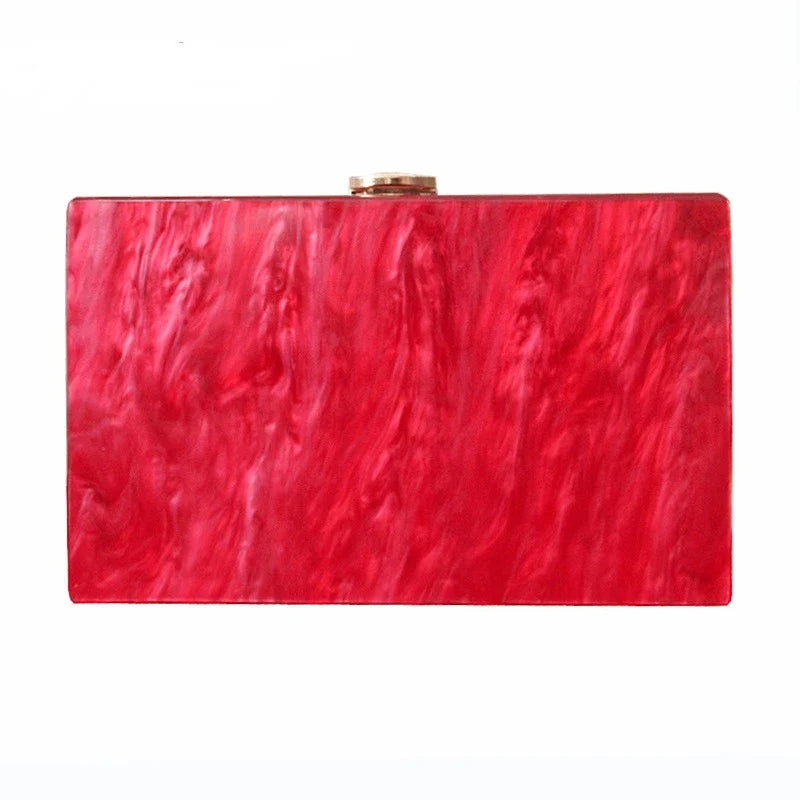 Stylish pearlescent acrylic clutch bag in red colour with a structured, square-shaped design
