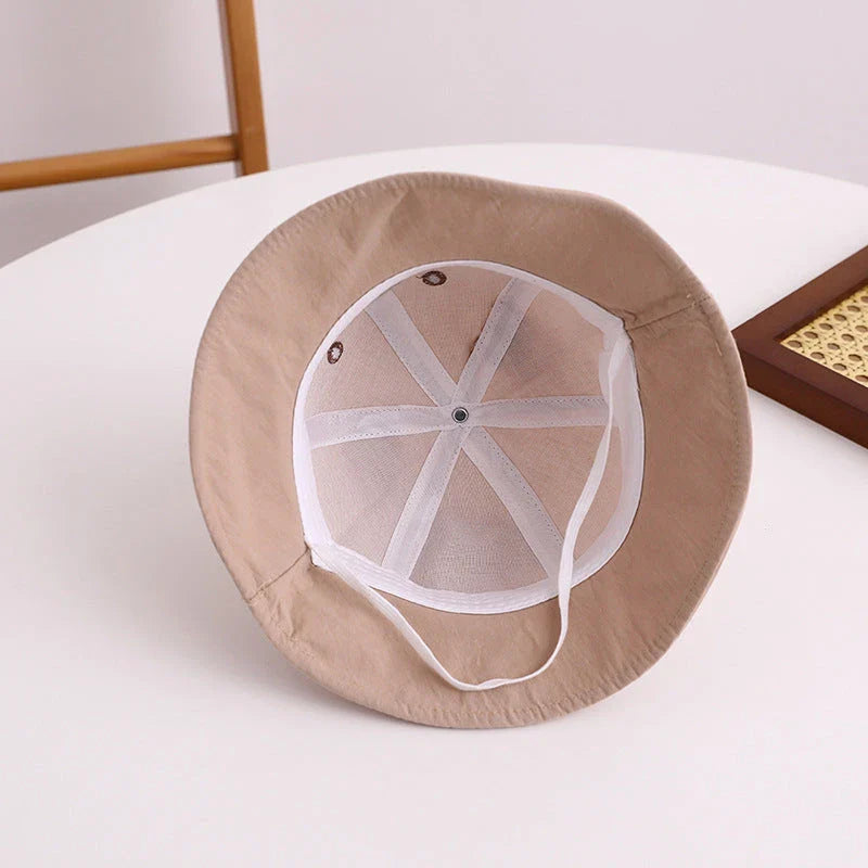 Adorable kids' bear-themed panama bucket hat with soft, breathable fabric and adjustable fit for sun protection and style